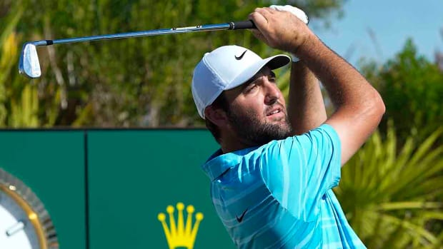Scottie Scheffler watches his shot from the 2nd tee during the final round of the Hero World Challenge at the Albany Golf Club, in New Providence, Bahamas, Sunday, Dec. 3, 2023.
